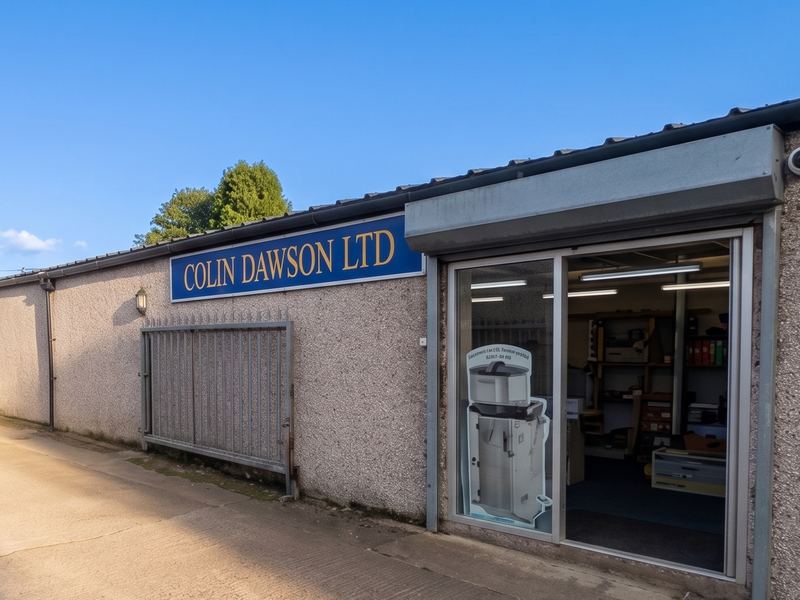 The entrance and sign of the Colin Dawson Ltd store at High Mill, Langwathby