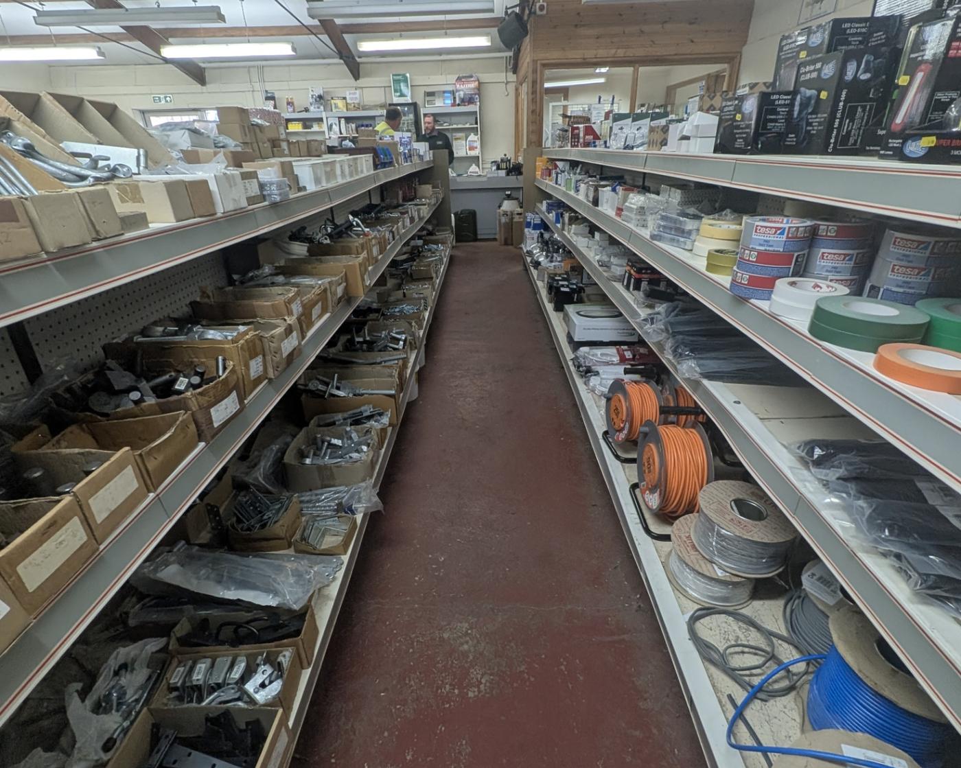 An aisle of agricultural supplies inside the store at Langwathby